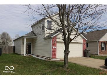 Charming two-story home with vinyl siding, brick accents, and an attached two-car garage at 42 White Lick Dr, Indianapolis, IN 46227