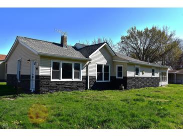 Charming single-story home with black and cream exterior and well-maintained lawn at 601 Duane St, Franklin, IN 46131