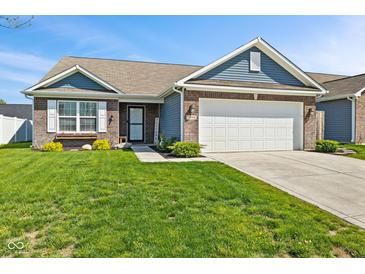 Charming single-story home features brick and siding exterior, attached two-car garage, and well-manicured lawn at 2936 W Calimanco Ln, Monrovia, IN 46157
