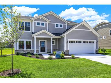Charming two-story home featuring a manicured lawn, two-car garage, and stylish gray siding at 3727 Thomas Jefferson Ct, Westfield, IN 46074