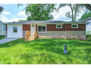 Charming single-story home featuring a well-maintained lawn and brick facade with a new wooden stair at 6189 Vigo Dr, Clayton, IN 46118