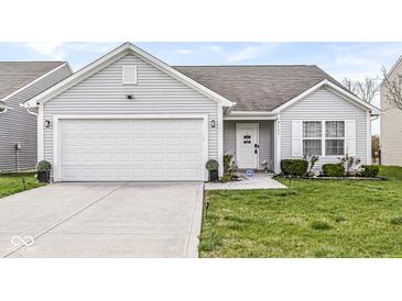 Charming single-story home with a two-car garage and well-maintained lawn at 9157 Tansel Crk Dr, Indianapolis, IN 46234