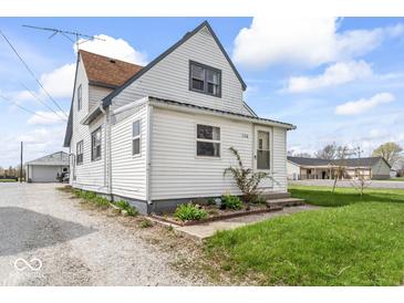 Quaint two-story home featuring charming details and a well-maintained lawn at 1126 N Anderson St, Elwood, IN 46036