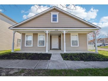 Charming single-story home featuring a cozy front porch with decorative columns and a well-maintained lawn at 14226 Marilyn Rd, Noblesville, IN 46060