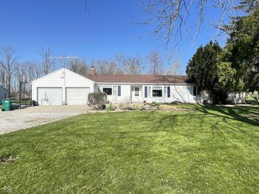 Charming single-story home featuring a two-car garage and well-maintained lawn at 2575 S Indianapolis Rd, Lebanon, IN 46052
