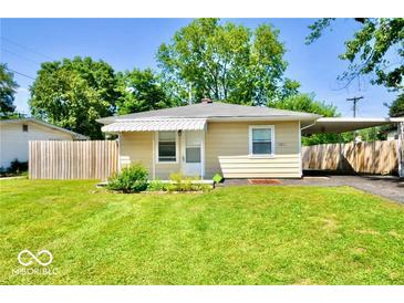 Charming single-story home features a well-maintained lawn and covered carport at 3021 Midvale Dr, Indianapolis, IN 46222