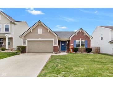 Charming home featuring brick and siding exterior, blue door and shutters, and a well-maintained front yard at 5157 Climbing Rose Pl, Indianapolis, IN 46254