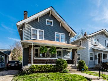Charming two-story home with blue siding and a brick-accented front porch at 5442 Hibben Ave, Indianapolis, IN 46219