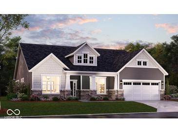 Charming single-Gathering home boasts stone accents, a well-manicured lawn, and an attached two-car garage at 6702 Thresher Pass, McCordsville, IN 46055