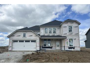 Exterior of a two-story home with a white garage door and covered porch in the construction phase at 16453 Alps Rd, Noblesville, IN 46060