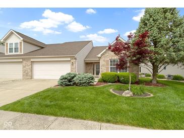 Charming brick home with a two-car garage and well-manicured lawn at 17777 Crown Pointe Ct, Noblesville, IN 46062