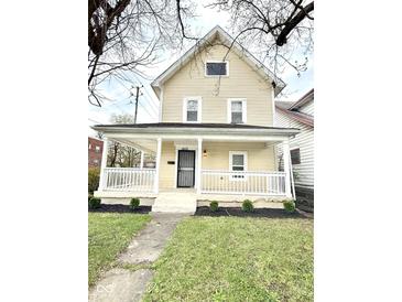 Charming two-story home with a covered front porch and well-maintained landscaping at 3502 N Illinois St, Indianapolis, IN 46208