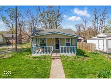 Charming single-story home featuring a cozy front porch and well-maintained lawn at 3346 S Lockburn St, Indianapolis, IN 46221