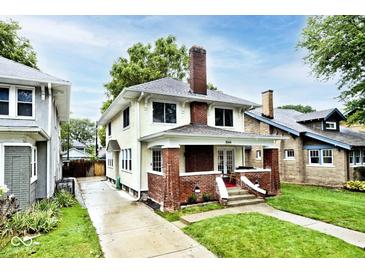 Charming two-story home with a brick chimney and inviting front porch at 3544 Guilford Ave, Indianapolis, IN 46205