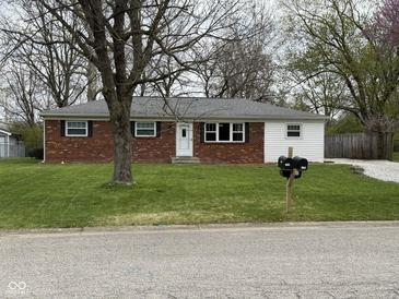 Charming single-story home with brick and siding, complemented by a well-maintained lawn at 5209 S Bancroft St, Indianapolis, IN 46237