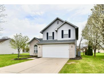 Charming two-story home with brick and siding, a well-maintained lawn, and an attached two-car garage at 6591 Rushing, Noblesville, IN 46062