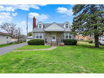 Charming stone-clad home with a well-maintained lawn and mature tree in a residential neighborhood at 1194 S Faculty Dr, Indianapolis, IN 46241