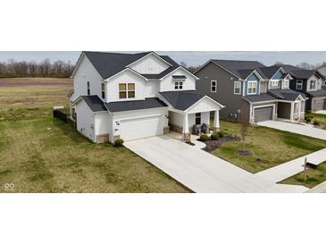 A beautiful two-story home boasts a large driveway, attached two-car garage and well-manicured lawn at 4810 Oak Hl Dr, Lebanon, IN 46052