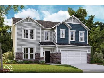 Charming two-story home with a two-car garage, stone accents, gray siding, and well-maintained landscaping at 7331 Deerberg Dr, Indianapolis, IN 46259