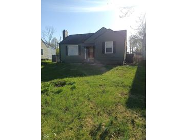 Charming home with a well-maintained lawn, welcoming entrance, and classic architectural details at 3505 N Layman Ave, Indianapolis, IN 46218