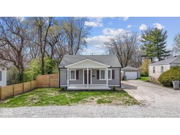Charming bungalow with gray siding, crisp white trim, and a cozy front porch at 3624 Wallace Ave, Indianapolis, IN 46218