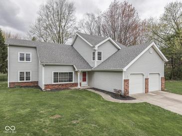 Traditional two-story home with attached two-car garage and well-maintained front lawn at 8160 Bold Forbes Ct, Indianapolis, IN 46217