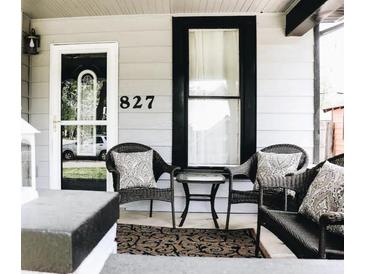 Inviting front porch with seating area, perfect for relaxing and enjoying the neighborhood at 827 Dawson St, Indianapolis, IN 46203