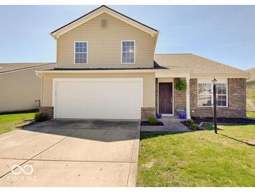 Charming two-story home with a two-car garage and well-manicured front lawn in a desirable neighborhood at 12723 Pinetop Way, Noblesville, IN 46060