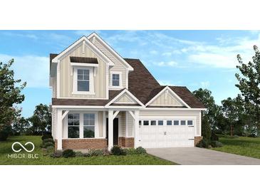 Charming two-story home features a neutral palette, a two-car garage, and a well-manicured lawn at 15970 Meadow Frost Ct, Fishers, IN 46037