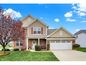 Charming two-story home featuring brick accents, red shutters, and a well-manicured lawn at 16758 Bingham Dr, Westfield, IN 46074