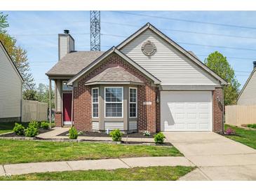 Charming brick and siding home with manicured lawn and bay window at 376 Lake Ridge Ln, Greenwood, IN 46142