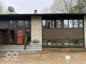 Stunning exterior of two story home, featuring stone accents and plenty of large windows at 4491 W Stones Crossing Rd, Greenwood, IN 46143