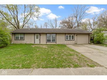Charming single-story home featuring a spacious front yard and private driveway at 4505 Phoenix Dr, Indianapolis, IN 46241