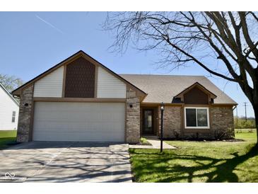 Charming single-story home featuring a brick facade, attached garage, and well-maintained front lawn at 12731 Slippery Rock Rd, Indianapolis, IN 46236