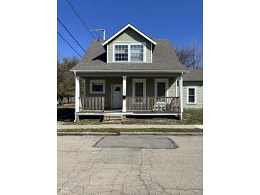 Charming two-story home with a covered front porch and well-maintained exterior at 312 S Gharkey St, Muncie, IN 47305