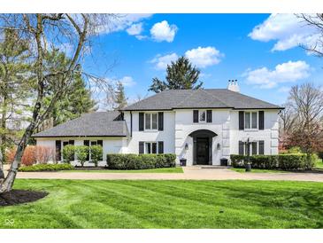 Charming two-story home features a well-manicured lawn, black trim, and an inviting entrance, with a beautiful blue sky at 4339 Royal Pine Blvd, Indianapolis, IN 46250