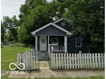 Charming home featuring a cozy front porch and fenced yard at 517 W 26Th St, Indianapolis, IN 46208