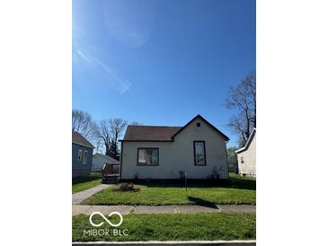Charming single-story home with a well-maintained lawn and classic architectural details at 833 W Franklin St, Shelbyville, IN 46176