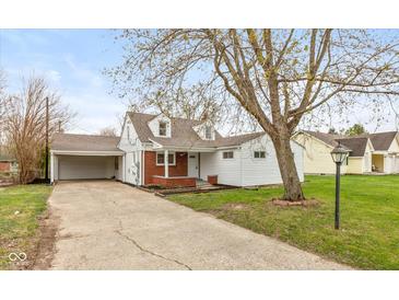 Charming single-Gathering home featuring a well-maintained lawn and a convenient carport at 217 Eikenberry St, Greenfield, IN 46140