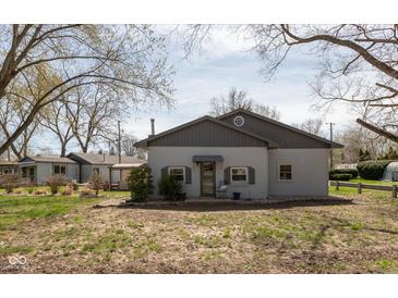Charming single-story home with a well-maintained exterior, windows, and mature trees at 218 Miami Dr, Noblesville, IN 46062