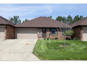 Charming single story brick home featuring a manicured lawn and attached garage at 572 Eagle Crest Dr, Brownsburg, IN 46112