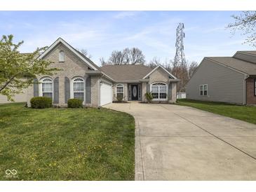 Charming single-story home with a well-manicured lawn and inviting curb appeal at 6846 Emerald Bay Ln, Indianapolis, IN 46237