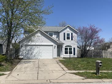 Charming two-story home with a two car garage, lovely landscaping and a beautiful yard at 11152 Dura Dr, Indianapolis, IN 46229