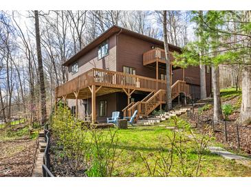 Expansive backyard featuring a spacious deck, perfect for outdoor entertaining and enjoying nature at 13306 W 50 S, Columbus, IN 47201