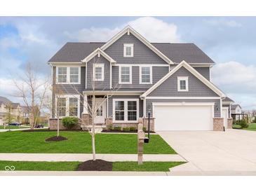 Charming two-story home featuring a manicured lawn and a classic gray and white exterior at 14878 Horse Branch Way, Fishers, IN 46040