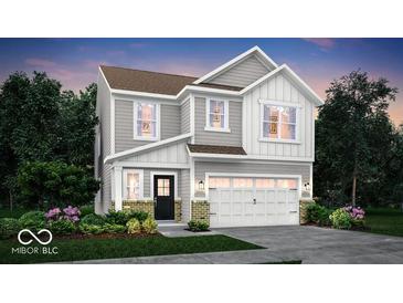 Charming two-story home with gray siding, white trim, and a welcoming two-car garage at 16930 Sandhurst Pl, Westfield, IN 46074