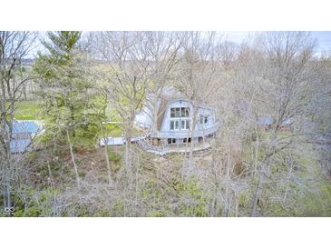 Unique home with a deck among the trees, offering privacy and a secluded feel at 1907 N Washington St, Danville, IN 46122