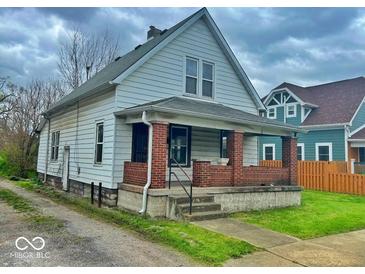 A charming two-story home with a brick porch and traditional architectural details at 359 W 26Th St, Indianapolis, IN 46208