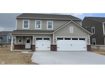 Charming two-story home featuring a spacious two-car garage, neutral siding, and a welcoming front porch at 4390 Risen Star Way, Bargersville, IN 46106