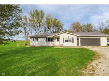 Charming one-story home with a well-manicured lawn and attached garage, perfect for comfortable living at 575 Everling Dr, Morgantown, IN 46160